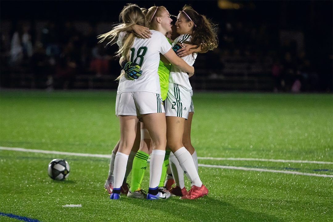 The Durham Lords Women's Soccer Team celebrating after winning a game.