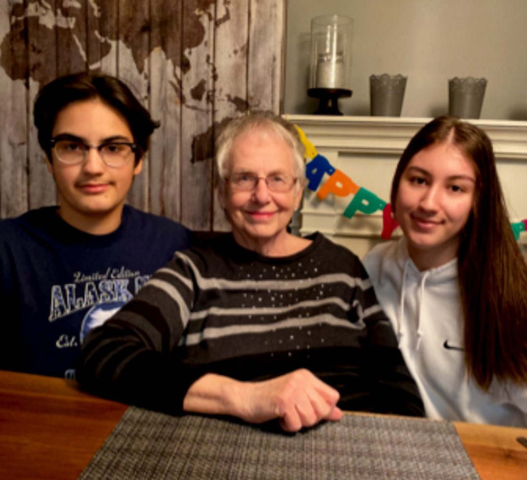 Catherine Millions, a nursing school graudate from 1961 with her two grandchildren on her 81 birthday