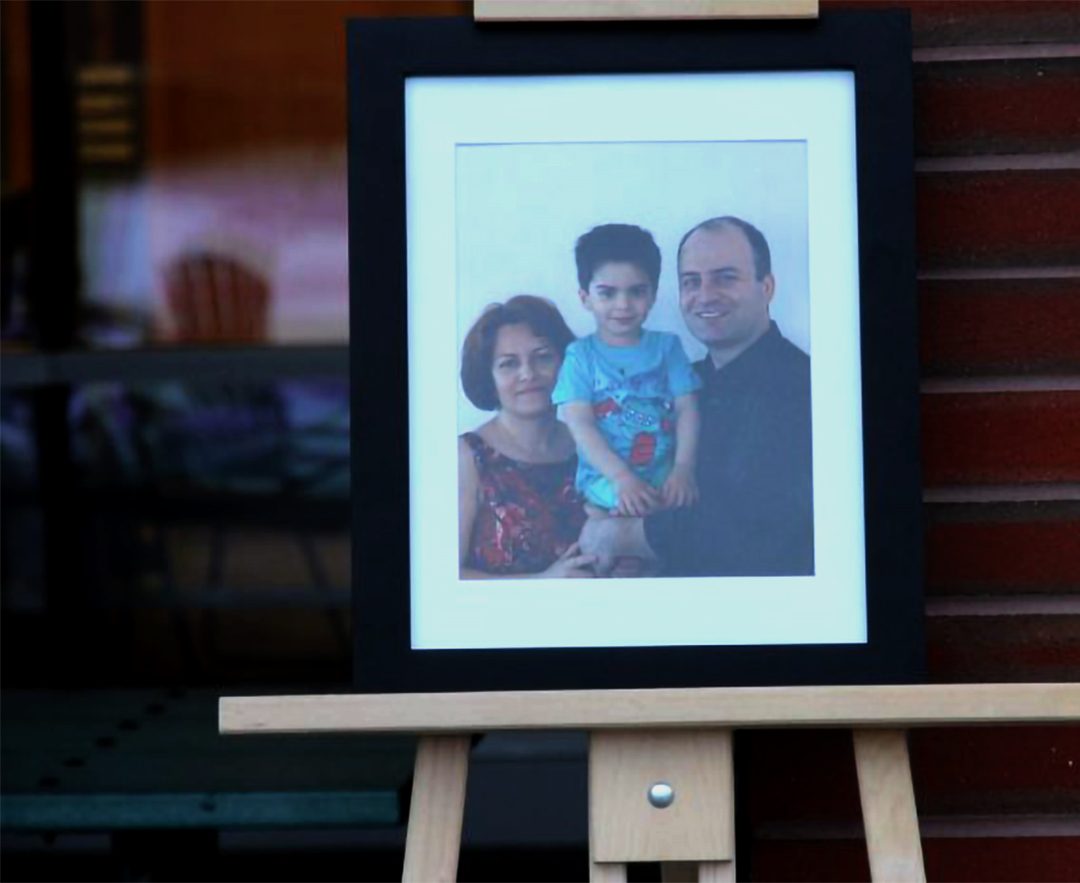 A portrait of Dr. Razgar Rahimi, his wife Farideh Gholami and their three-year-old son Jiwan.
