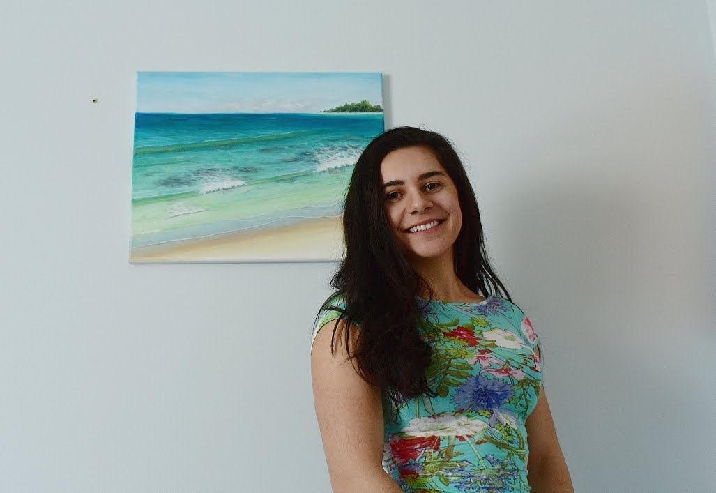 Katherine Polack poses with her ocean-inspired art.