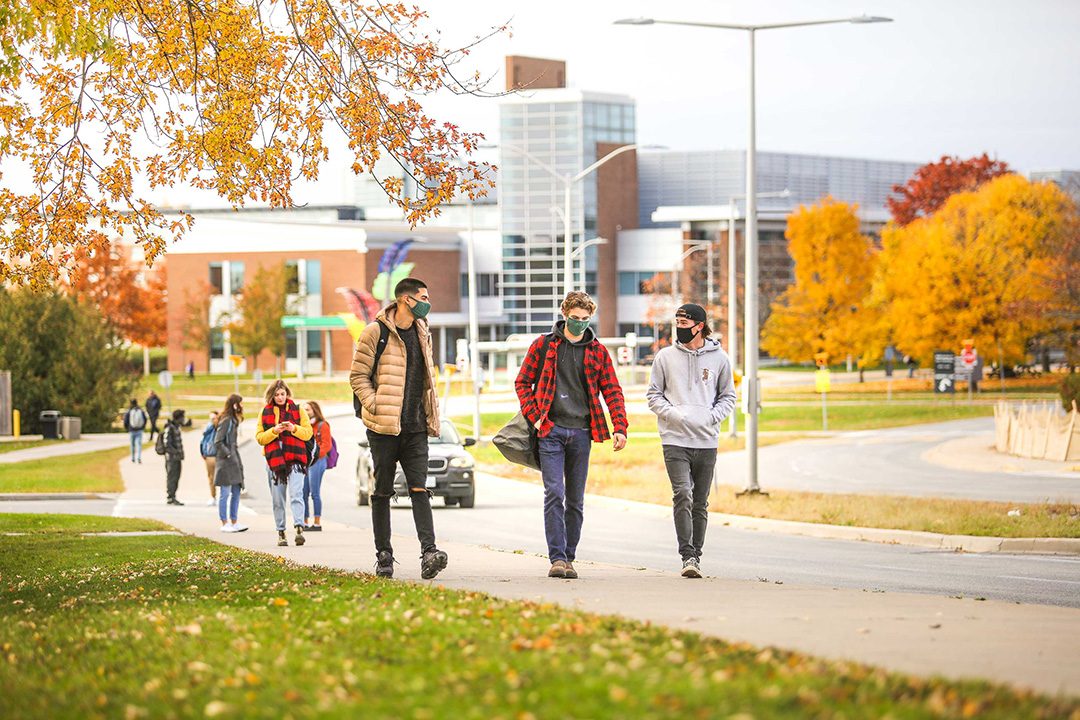 Student life is coming back to campus as masked students walk around between classes.