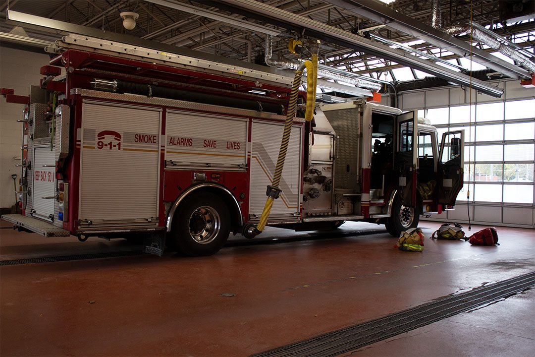 A fire truck arriving at the Oshawa Fire Station 1.