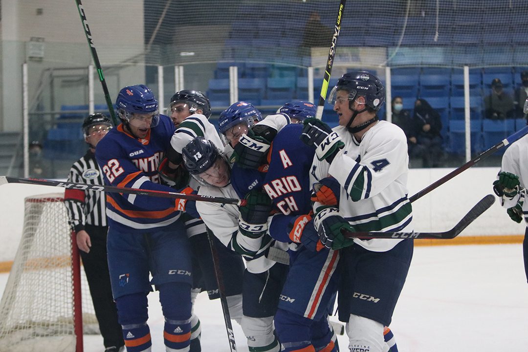 Scrum in front of Nippising Laker goaltender.