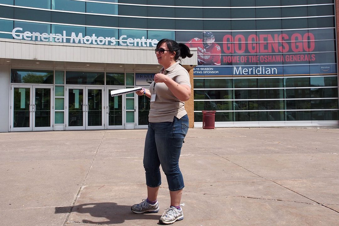 Lisa Terech outside the General Motors Centre while guiding an Oshawa walking tour ran by the Oshawa Museum.