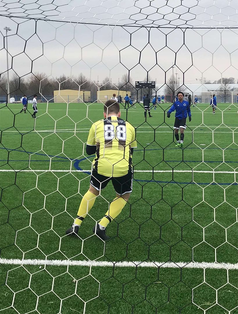 Garrett Werner a goalie for the Durham College Lords pictured during a game ready to save a goal.