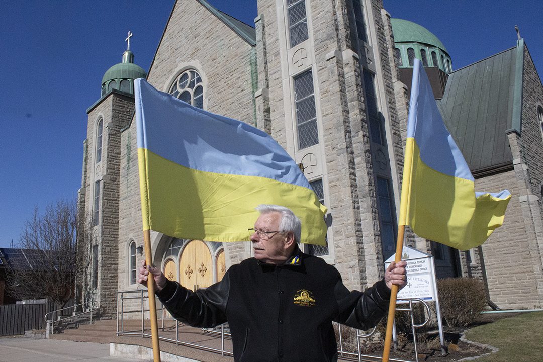 UCC members hand out Ukraine flags.