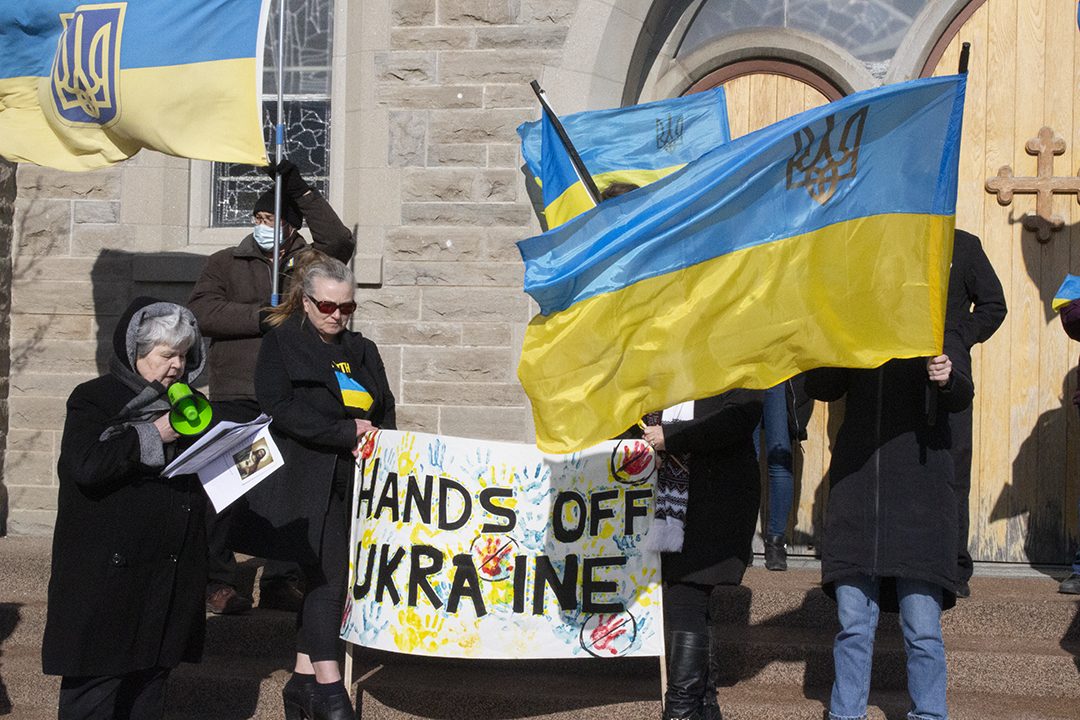 Odraka Matyzak recites a prayer for Ukrainian people.