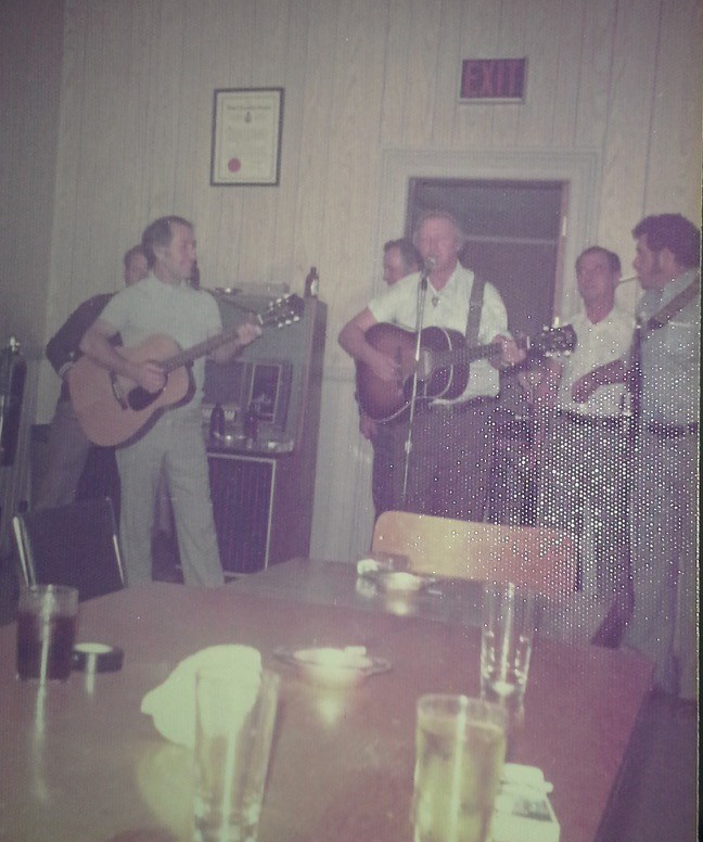 Stephen Cosgrove (left), playing guitar in a band inside the Brooklin Legion.