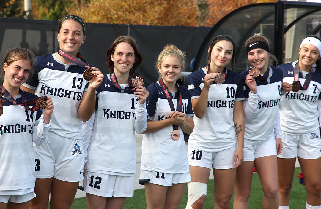 The Knights celebrating their bronze medal.