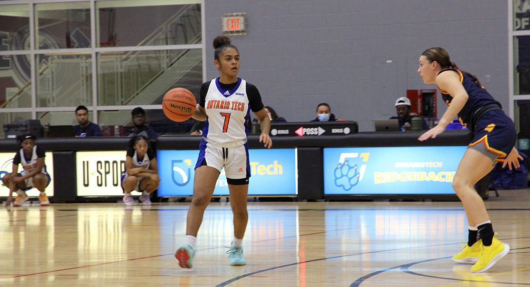 Ontario Tech women's Ridgeback basketball player Alexis Remekie dribbling the ball up the court.