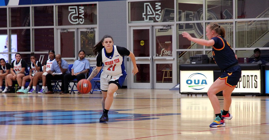 Ontario Tech women's Ridgeback basketball player Kamelya Brodeur looking to make a pass to a teammate to score a basket.