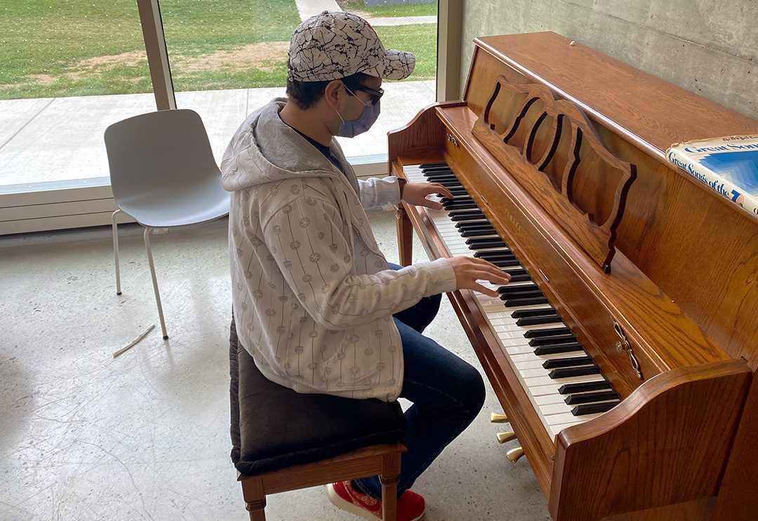 Ahmed Gamal playing the piano in the Energy Systems and Nuclear Science Research Centre (ERC) at Ontario Tech university. Gamal has been playing the piano since the age of 15. He doesn't play as often but enjoys the moment.