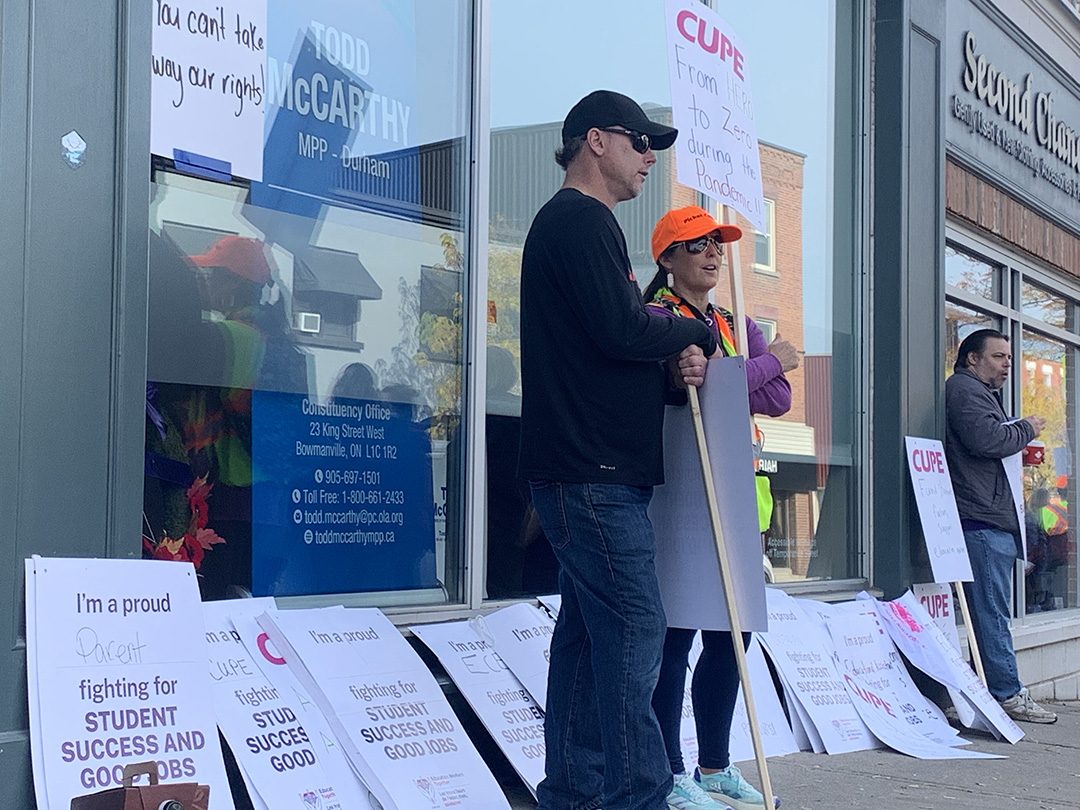 CUPE members and supporters gather outside local MPP Todd McCarthy's office on day one of the strike.