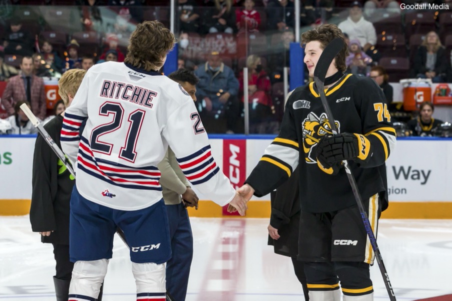 Calum meets older-brother Ethan at centre ice for the ceremonial puck drop for the Generals vs Sting game on Nov. 20.