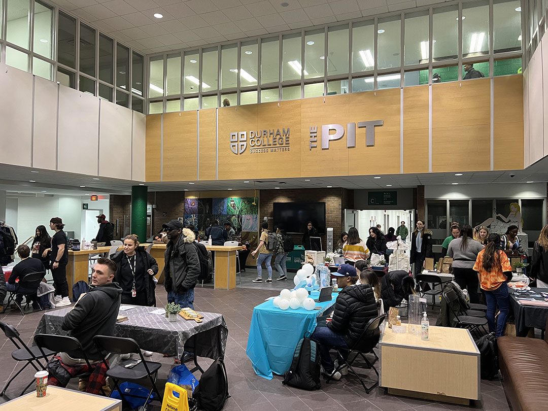 Students and faculty gathered in the Pit at the holiday market.