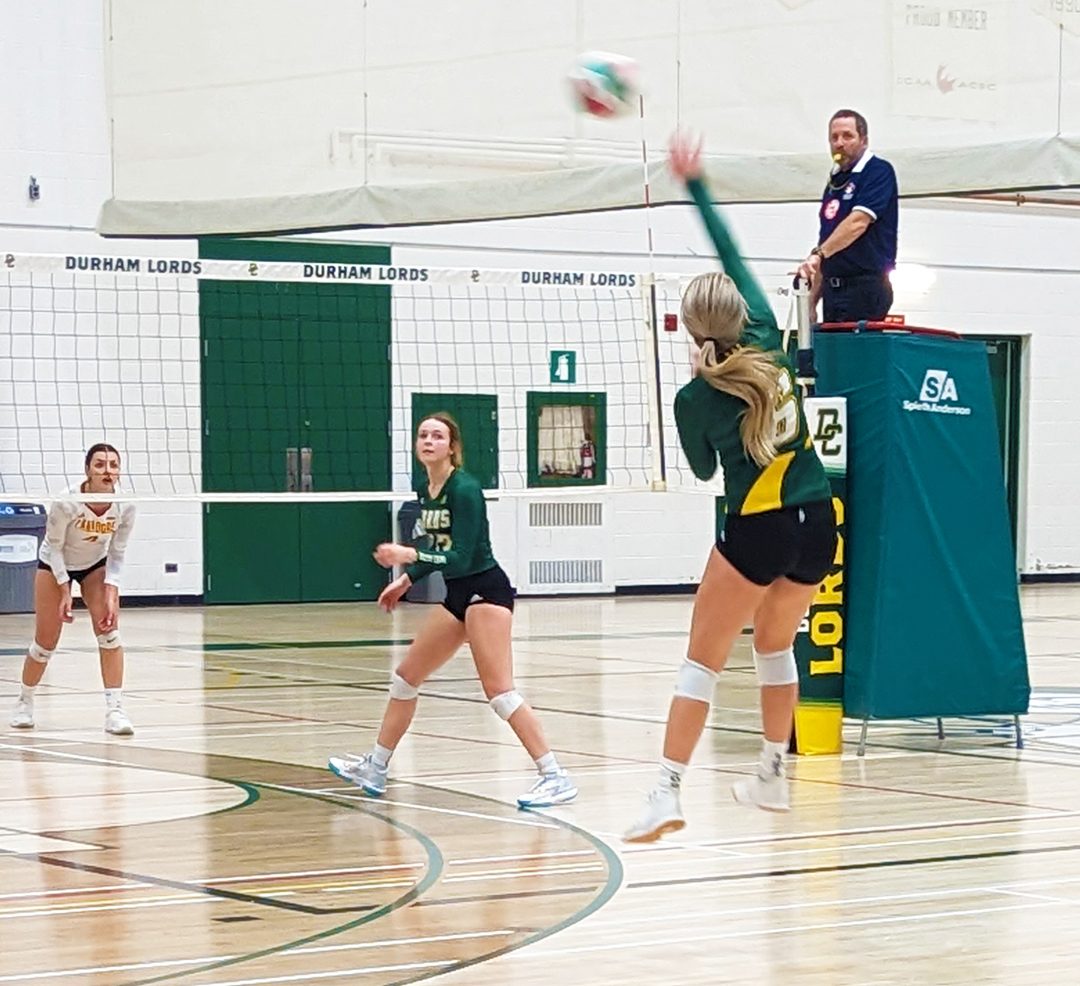 Jessica Joensen leaping in the air to play the volleyball in the Adidas Cup championship match against Canadore.