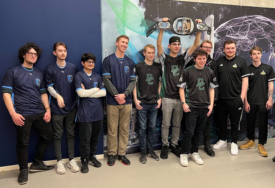 The Durham Lords (right) accepting the Esports Campus Champions belt after beating Ontario Tech (left) 4-1 in a best-of-7 Rocket League matchup at the arena opening.
