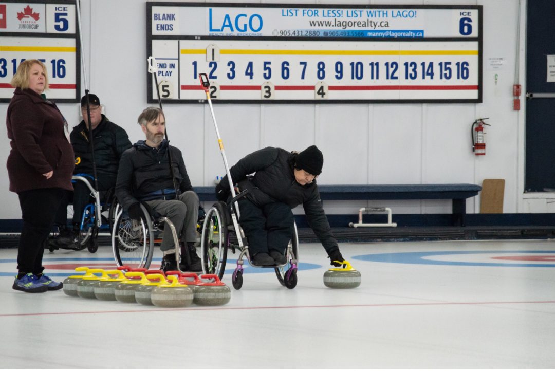 Oshawa, Ont.-2023-02-04 – Team Thurston prepares their first rock of the 5th end at the 2023 Ontario Parasport Games. The team placed first in the 2023 Ontario Wheelchair Provincial Curling Championships in January. Skip Jon Thurston and vice Collinda Joseph won wheelchair curling bronze for Canada at the 2022 Beijing Paralympics. Photo by Andrew Neary