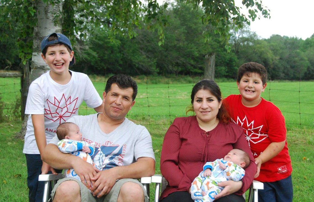 Eyad Mousa and Rohat Hamo with their children in September 2017, six months after immigrating to Canada.