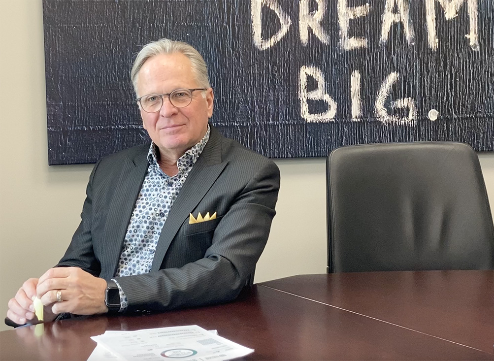 Durham College President, Don Lovisa, sits for an interview to discuss the colleges economic impact. DC has an impact of $913-million in Durham Region.