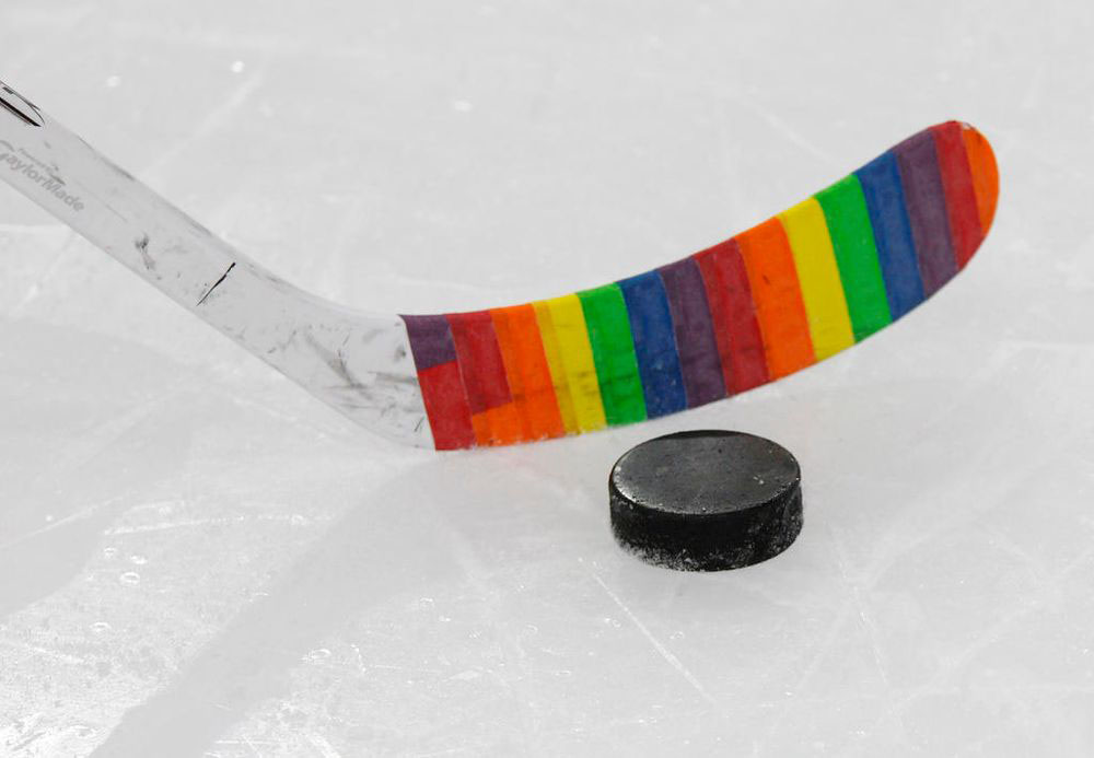 The Buffalo Sabres and San Jose Sharks wrap sticks in pride tape to support the LGBT community during the first period of an NHL hockey game in Buffalo.