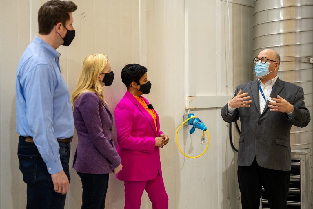 (Left to right) Federal Ministers Ryan Turnbull (Whitby), Jennifer O'Connell (Pickering-Uxbridge), and Marci Ien (Toronto-Centre) speak with John Komar during their tour of Ontario Tech's ACE research facility on April 12, 2023.