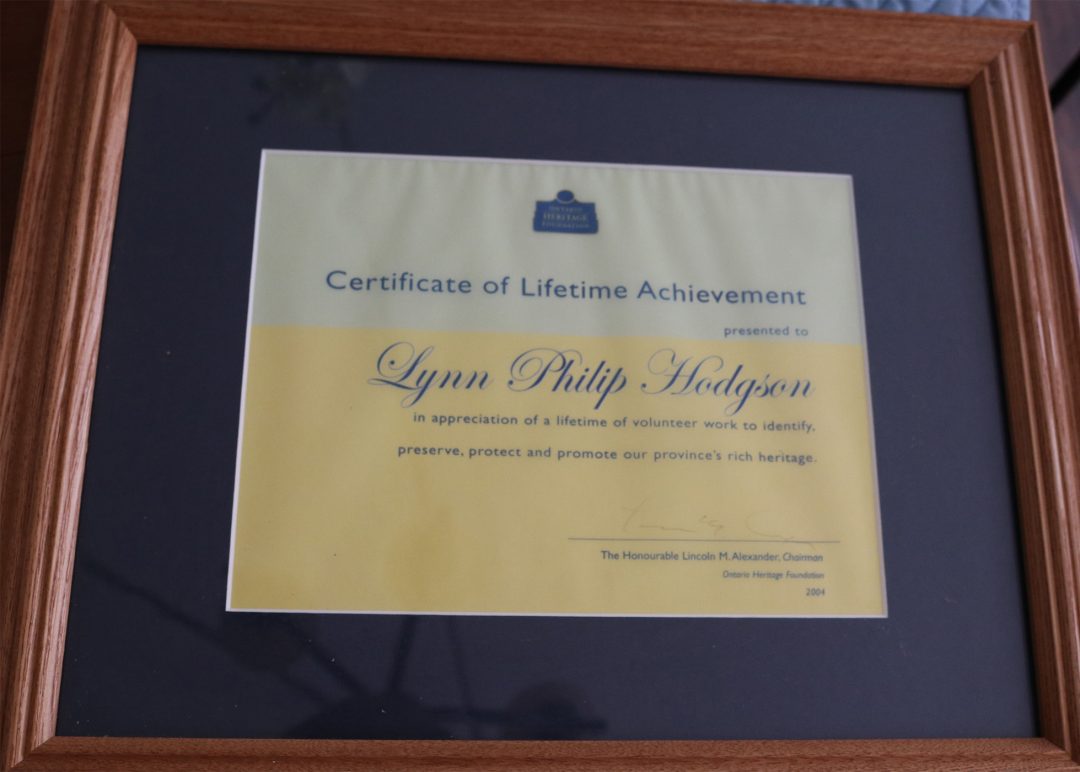 A framed certificate that reads 'Certificate of Lifetime Achievement'.