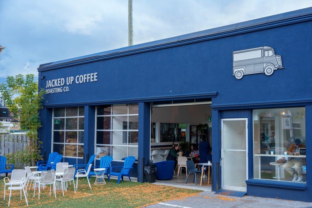 An exterior photo of the Jacked Up Coffee's blue garage-turned-coffee-house roasting location on Brock Street in Whitby, Ont.