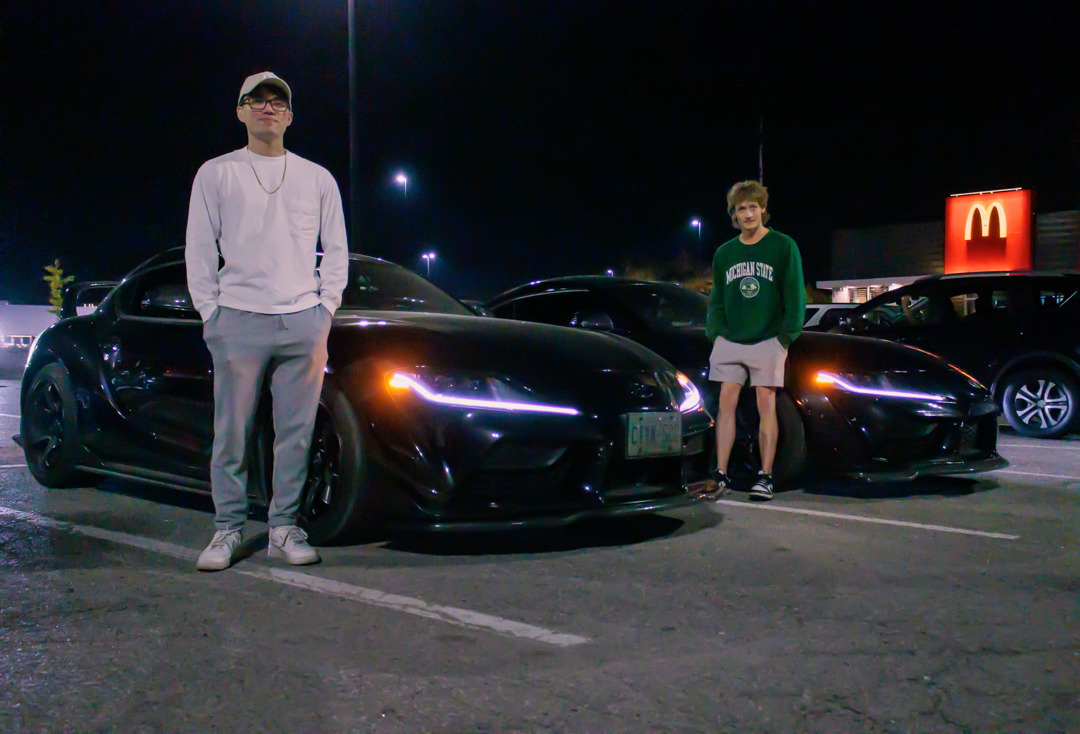 Two black Toyotas parked beside each other