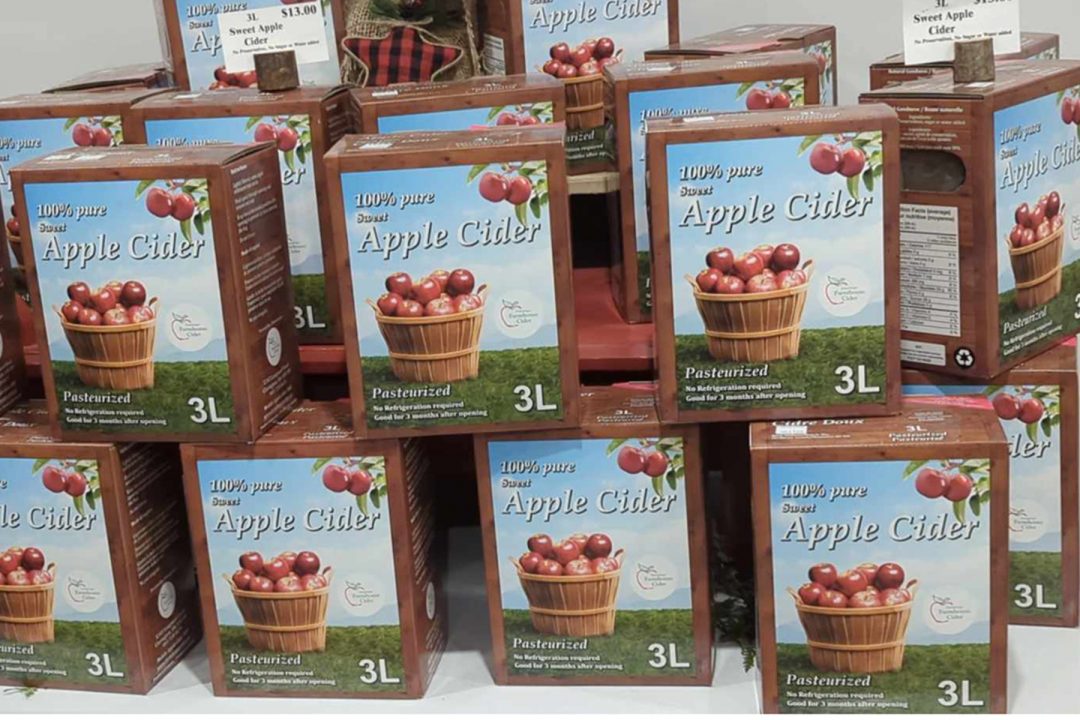 One of the finished products at Geissberger Farmhouse Cider. A three-litre box of pasteurized apple cider in a Forest Sustainable Certified box made in Scarborough.

The three-litre boxes are stacked up like a pyramid for display.