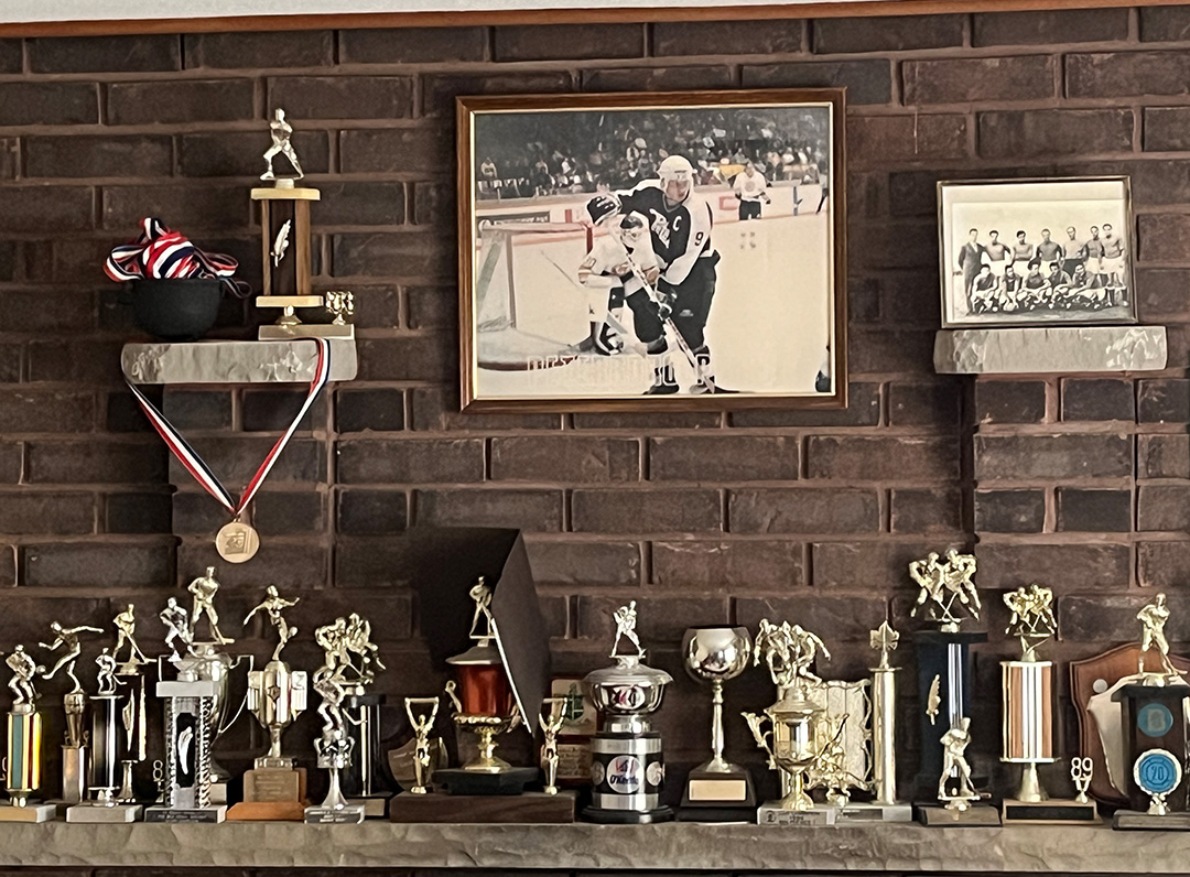 Trophies sitting on a mantle.