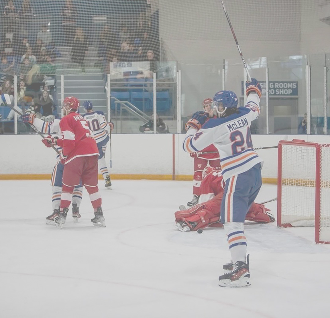 Cullen McLean, Ontario tech Ridgebacks men's hockey team forward celebrating a goal against the McGill Redbirds hockey team