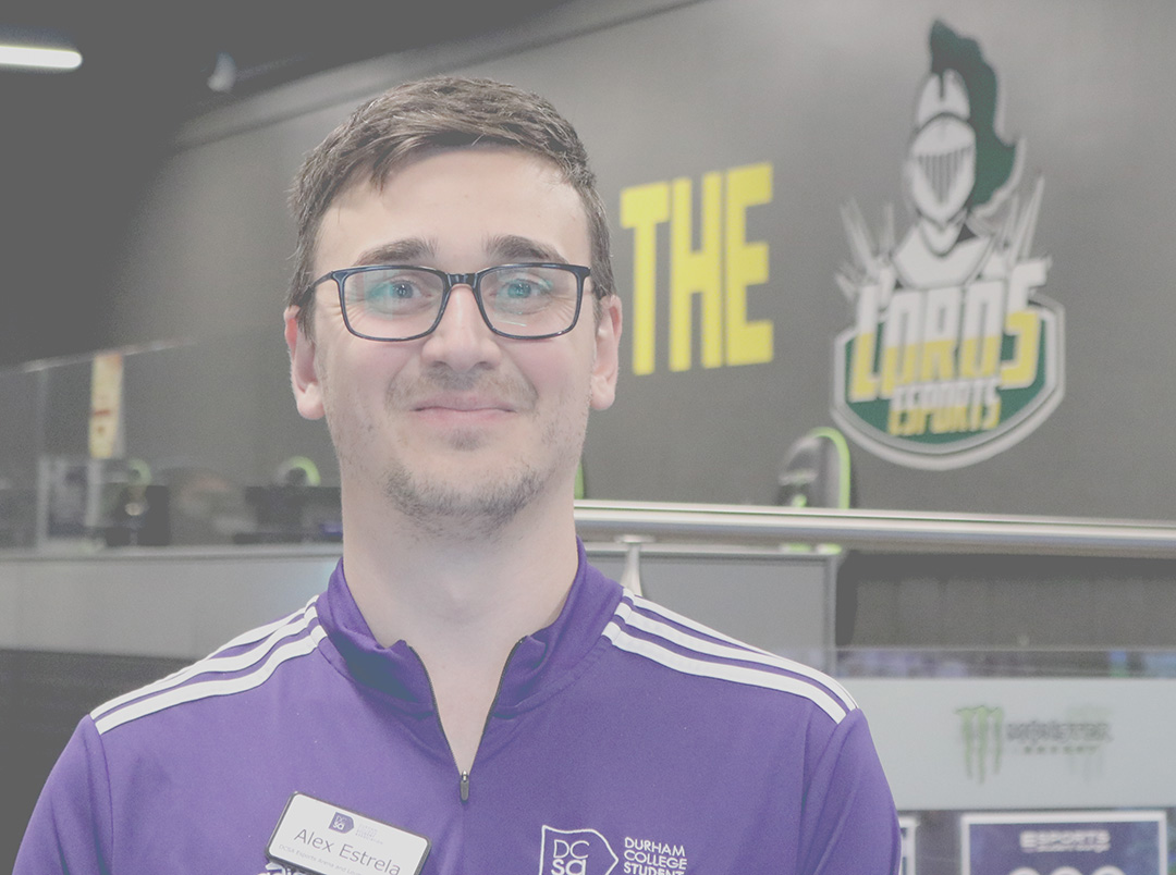 Esports Coordinator Alex Estrela stands in front of the DC Lords Esports gaming space at Durham College, Oshawa.