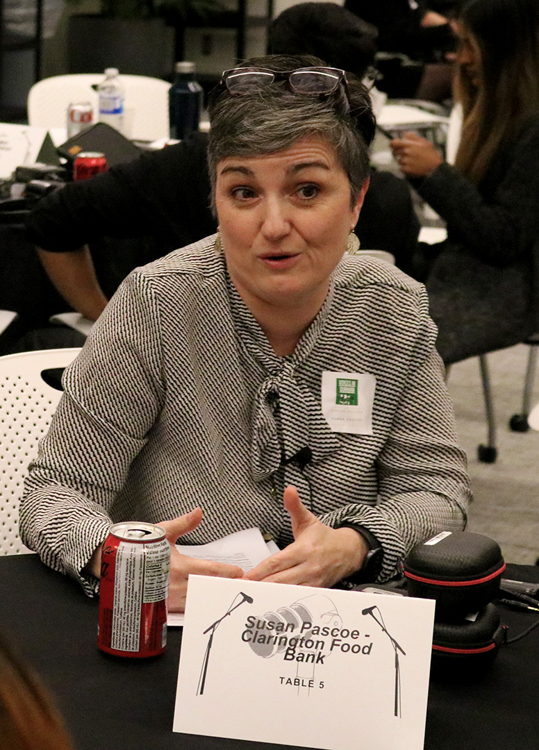 Susan Pascoe, executive director of the Clarington East Food Bank, sitting at a table at the annual Community Listening Event in Durham College on Nov. 18, 2024