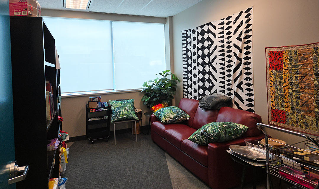 The inside of the Maarifa room at Durham CAS in Oshawa, Ont. on Dec. 5, 2024. 'Maarifa' is the Swahili word for 'knowledge'. On the bookshelves to the left, there are books about Black culture available to be borrowed. Off-screen to the right is a cabinet with personal care products such as hair care materials.