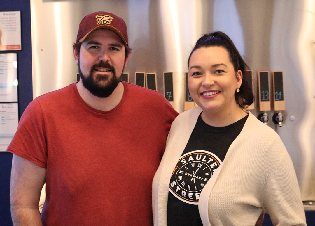 Colin Simic (Left) and Kyla Munro (Right), owners of the Torchbearer Taproom in Oshawa, Ont. on Jan. 16, 2025. After a failed attempt to start brewing their own beer, they decided to open a taproom that showcases local breweries. Jack Conway/The Chronicle