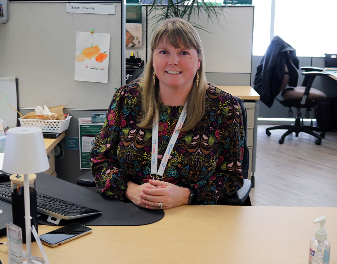 Sarah Edwards, an international students advisor at Durham College, assists students at the International Students Office in Oshawa, Ont., on Jan. 14, 2025. Adjusting to the harsh Canadian winter is a significant challenge for many international students arriving at the college this year.