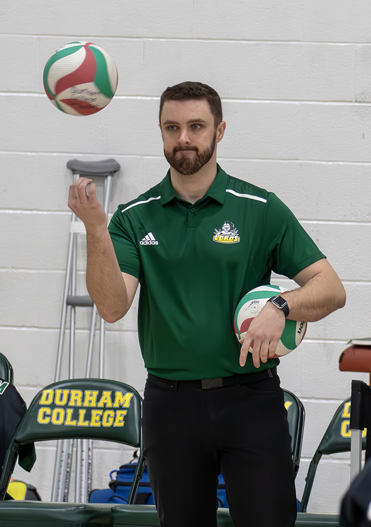 Assistant coach Tyler Krabi before Durham’s match against Algonquin.