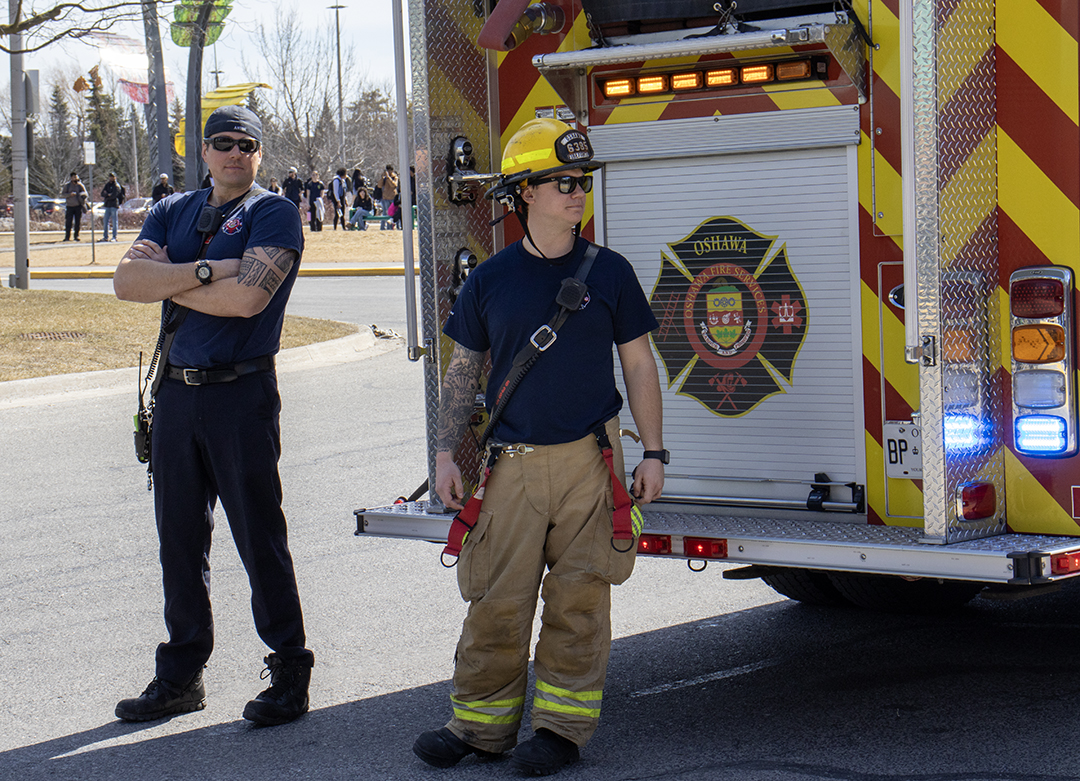 Fire Marshals wait for a response from colleagues investigating the scene inside.