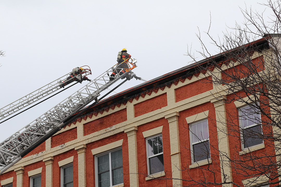 Crews battling a fire in downtown Bowmanville from aerial positions on Mar. 6, 2025. The blaze destroyed multiple buildings home to several businesses and residential units.