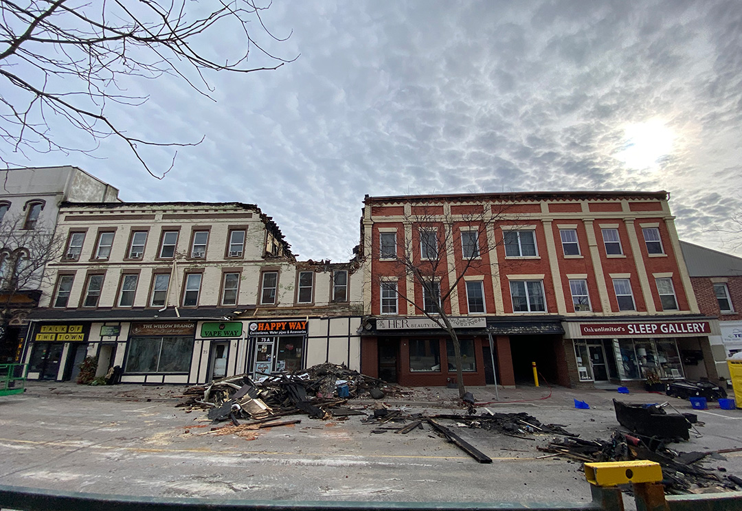 Partial demolition work has begun on a building gutted by a fire in historic downtown Bowmanville on Mar. 6, 2025. The work is being done as part of the Ontario Fire Marshal's investigation into the cause of the blaze, which destroyed several businesses and residential units, displacing over 30 residents and claiming the life of one person.