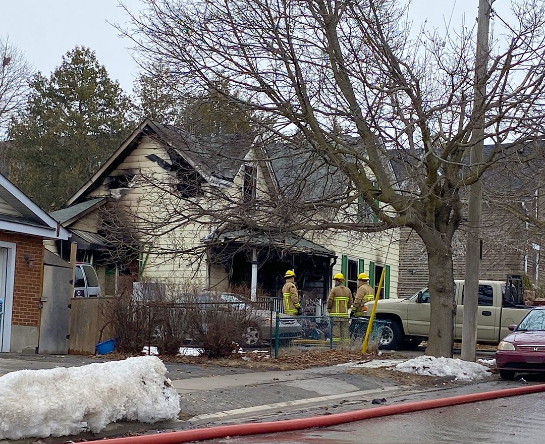 Officials investigate the scene of a deadly fire on McGrigor Street in Oshawa.