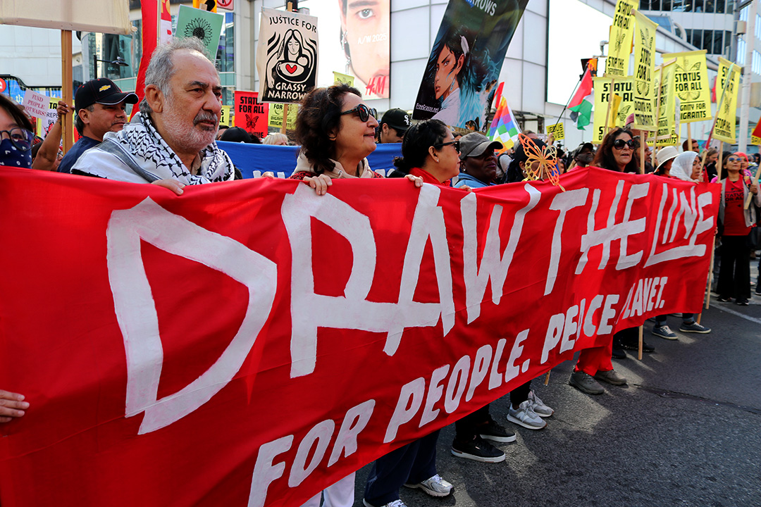 People holding a red banner.