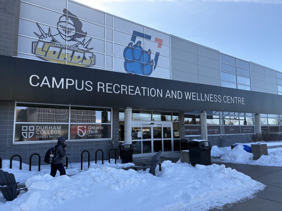 A great building with a logo of a knight and the word Lords as well as a logo of a dog paw. The sign on the front reads Campus Recreation and Wellness Centre.