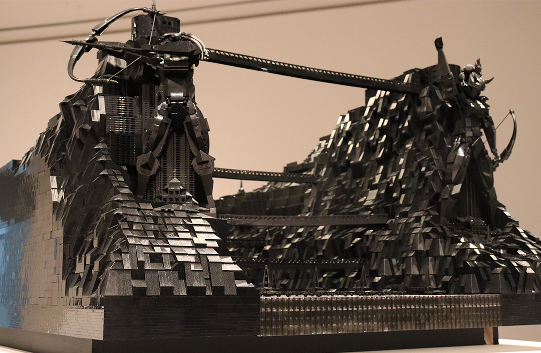 Thousands of LEGO black bricks create a sculpture.