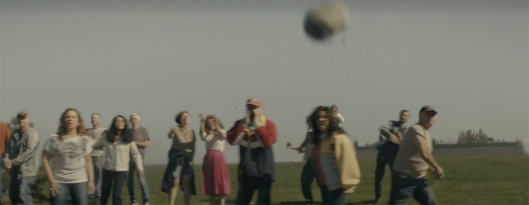 Civilians throwing rocks at Beans' family car. Photo credit CBC Gem