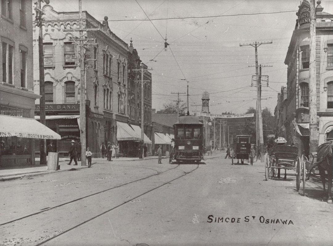 A black and white depiction of Simcoe Street in Oshawa from the 20th century